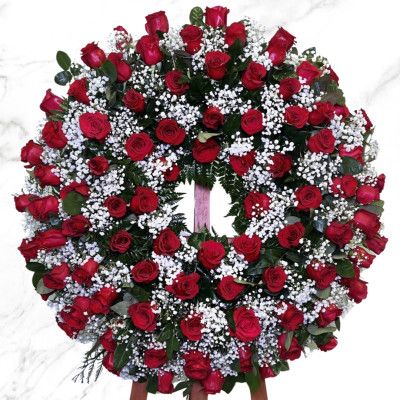 Corona funeraria de rosas rojas